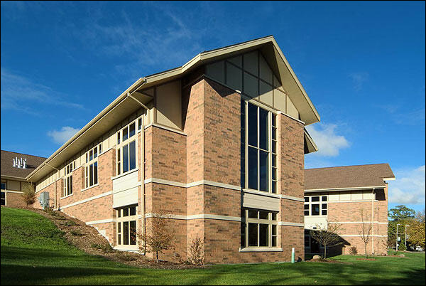 Milwaukee electrical design build firm makes clean CAD plans and performs on time installation of power and lighting systems Pewaukee Library Exterior after New Lighting System Installation